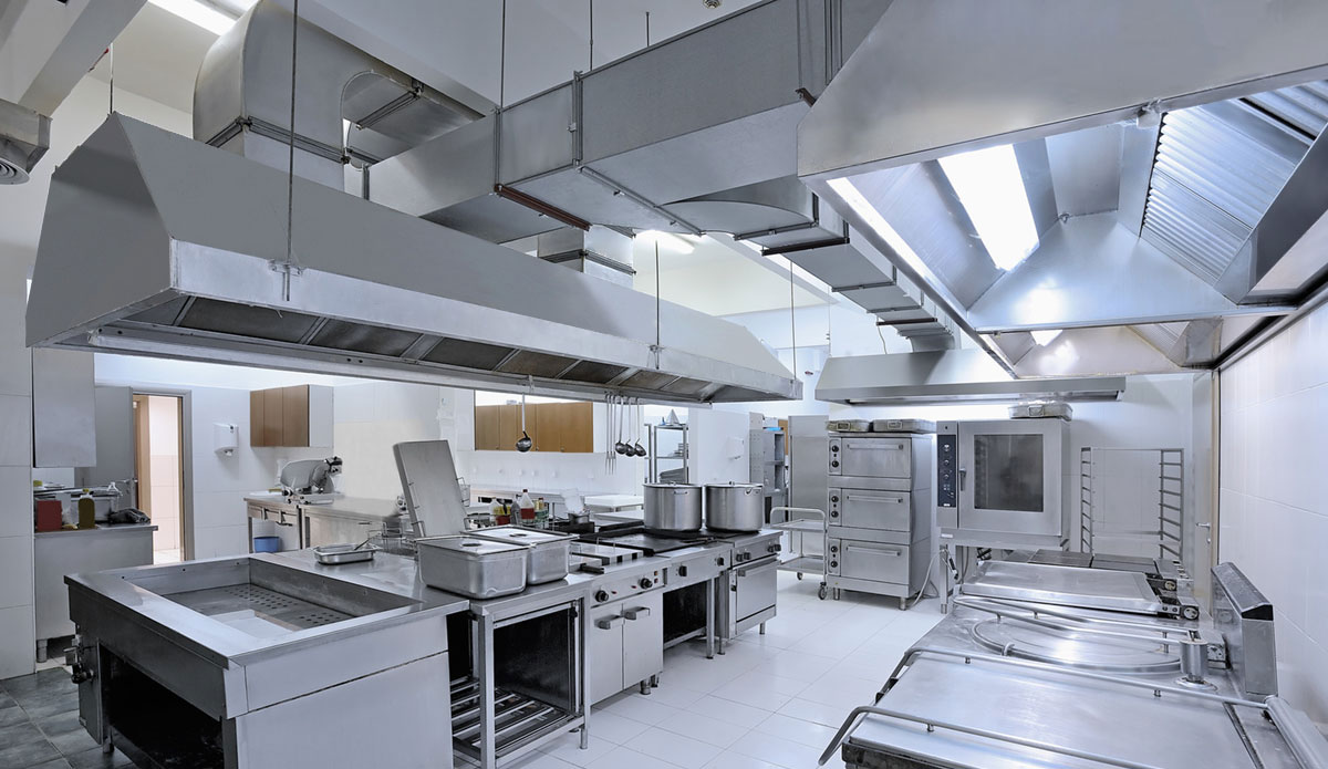Commercial kitchen power cleaning service showing deep cleaned restaurant hood system and equipment by APS-Hoods Denver